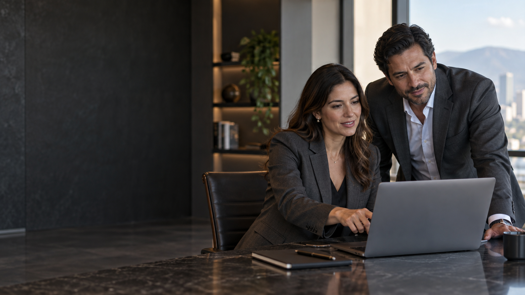 Executive team working at a computer